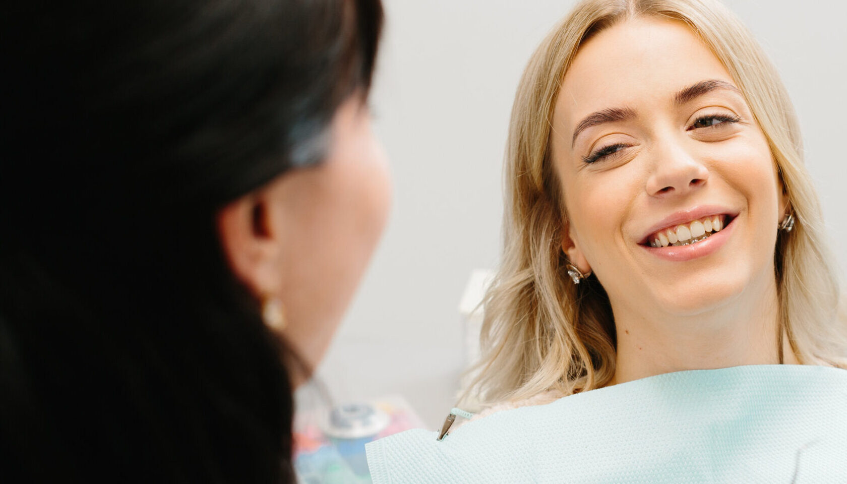 Doctor talking with her patient. Dentist concept